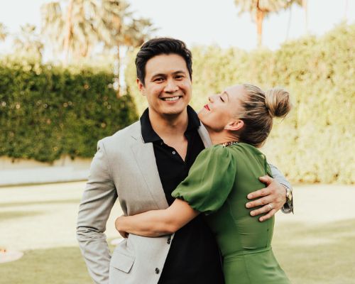 Briga Heelan posing with her husband Rene Gube 